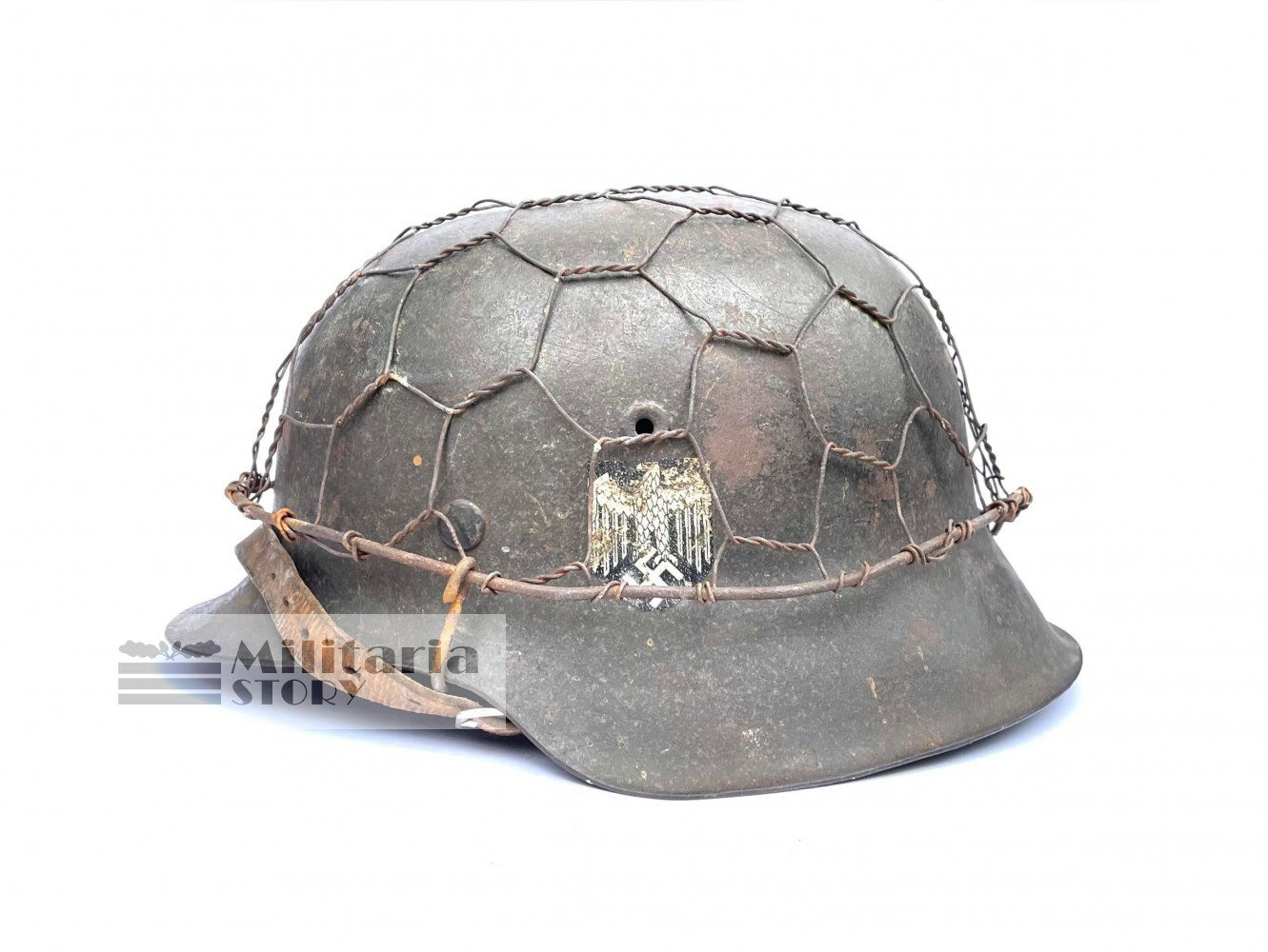 Heer M42 steel helmet with chiken wire camo - Heer M42 steel helmet with chiken wire camo: WW2 German Headgear